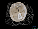 a picture of a hat with a birdcage on it