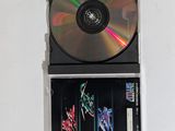 two cds sitting on top of each other on a table