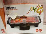 a box that has a grill on it on a table