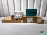 three boxes of electronic devices are stacked on top of each other