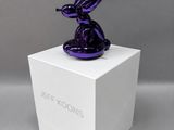 jeff koons purple rabbit sculpture in a white box on a grey background