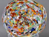 an image of a colorful glass bowl on a stand