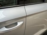 a close up of a car door handle with a sticker on it