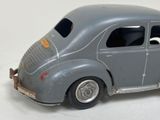 a toy car that is sitting on a white surface