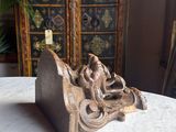 a bookend that is sitting on a table in front of a cabinet