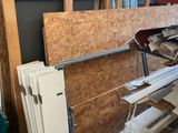 a picture of a room with a lot of wood and a radiator