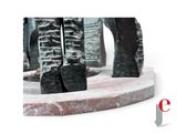 a statue of an elephant that is standing on a pedestal