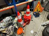 a pile of assorted items on the floor of a garage