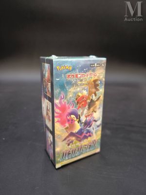 a box of pokemon trading cards sitting on a table