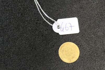 a gold coin with a price tag attached to it