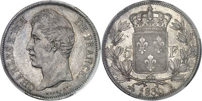 a close up of a coin with a crown on top of it