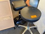 a stack of chairs and a stool in a room