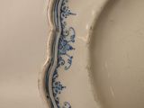 a white plate with a blue border on it