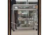 a large mirror with a black frame on the wall