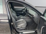 a car door open with the driver ' s seat down
