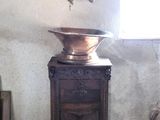 a large bell sitting on top of a table in a room