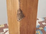 a piece of wood that is sitting on a tiled floor