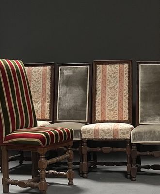 four chairs that are sitting next to each other