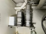 a picture of a kitchen with a lot of dishes on a shelf
