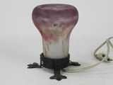 a lamp that is sitting on a table with a cord