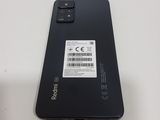 the back of a black phone with a sticker on it