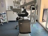 a dentist chair in the middle of a room