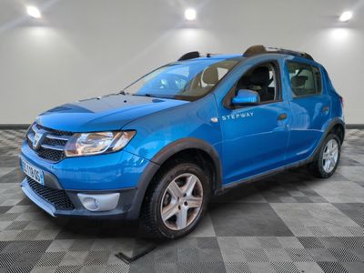 the blue dacia is parked on a checkered tile floor