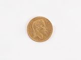 an image of a gold coin on a white surface