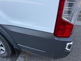 a close up of the rear end of a white van