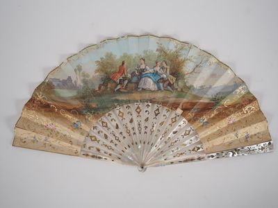 a fan with a painting on it hanging on a wall
