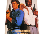 a poster of two men holding guns on the cover of a magazine