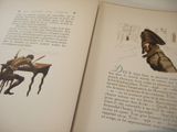 an open book with a picture of a man sitting at a desk
