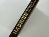 a close up of a mascara tube on a white surface