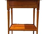 a small wooden table with a shelf underneath it