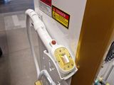 a machine that is sitting on the floor next to a wall