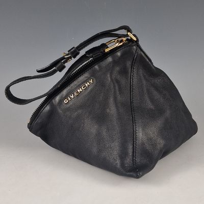 black leather handbag with gold hardware and zipper closure