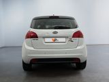 a white car that is parked in a room