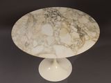 an image of a white marble table with a white pedestal