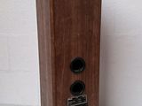an image of a wooden speaker sitting on top of a white table