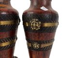 two vases that are sitting side by side on a white background