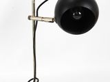 an image of a black lamp on a metal stand on a white background