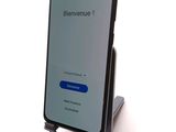 an image of a cell phone with a blue button on the screen