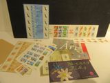 a black suitcase filled with stamps and postcards on a table