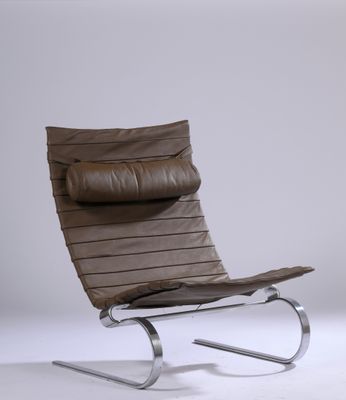 an image of a brown leather lounge chair on a white background