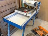 a picture of a table with a saw on it in a room