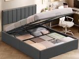 an image of a bedroom with a bed with a storage underneath it