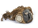 an image of a mask with a face made out of wood