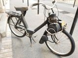a bike that is parked on the side of the street