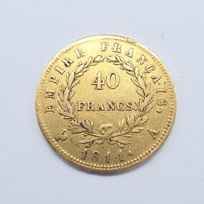 l'image d'une pièce d'or sur laquelle figure le chiffre 40