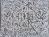 a close up of a stone block with writing on it